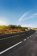 Bending country road background on daylight.