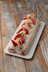 Whipped egg whites dessert with buttercream and fresh strawberries