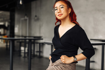 Beautiful asian woman , posing smiling and looking at camera, happy asian woman smiling indoors