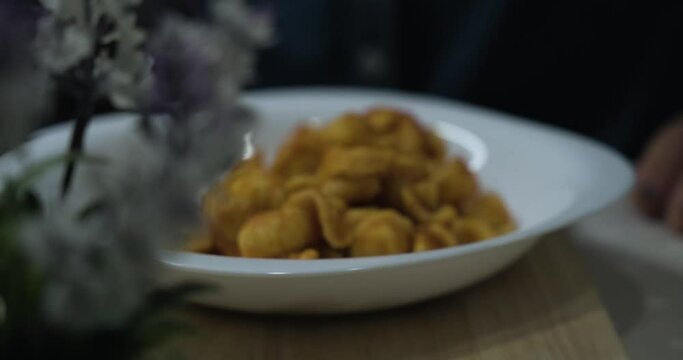 The first course of orecchiette with sauce, a typical Apulian dish. Typical Italian cuisine