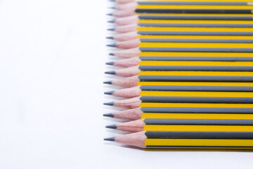 Yellow and Black graphite pencil group on white background. Copy Space concept