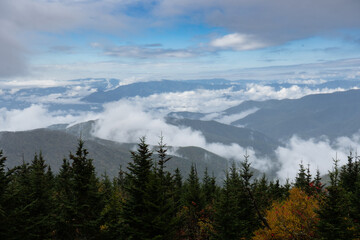 Naklejka na ściany i meble Smoky Mountains Peak Through Autumn Clouds Fog from Peak
