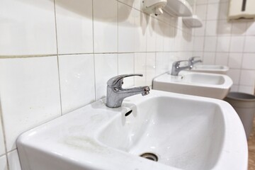 Taps an basins in a row