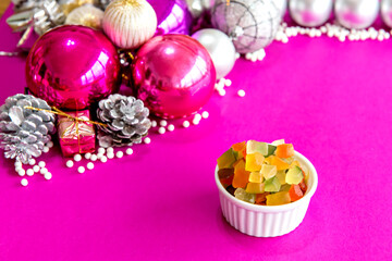 Candied fruit on a pink Christmas background