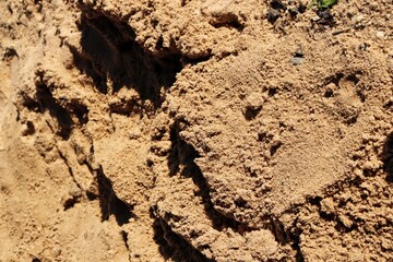 Close up of brown sand with shadow background or texture