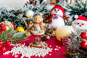 Christmas ornaments on red background.
