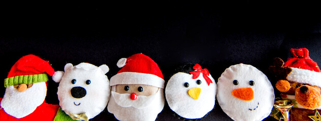 Christmas ragdolls on black background.
