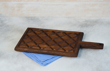 empty wooden old textured cutting board on concrete table for desidn , mock up for copy space text, food concep and table setting blank