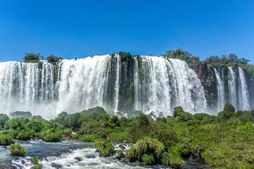 Fototapeta premium Iguazu Falls, located on the border of Argentina and Brazil, is the largest waterfall in the world.
