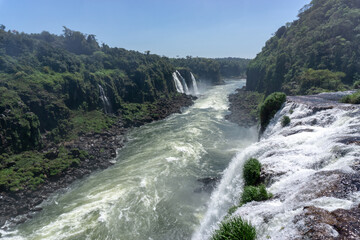 Fototapeta na wymiar Iguazu Falls, located on the border of Argentina and Brazil, is the largest waterfall in the world.