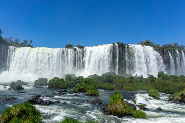 Fototapeta premium Iguazu Falls, located on the border of Argentina and Brazil, is the largest waterfall in the world.