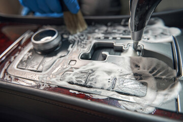 Fototapeta na wymiar Photo of detailing car interior by foam detergent