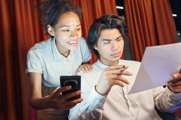 American people dictating information from smartphone in office