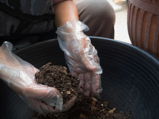Closeup soil mud dark brown texture sand macro environment save worldwide global earth planet holding finger tree leaf clean pollution ecology environment natural garden healthy organic concept