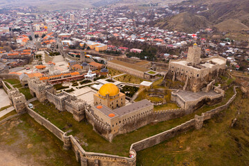 Fototapeta premium Panoramic aerial view of reconstructed medieval fortified Rabati Castle in small Georgian city of Akhaltsikhe on spring day, Samtskhe-Javakheti region