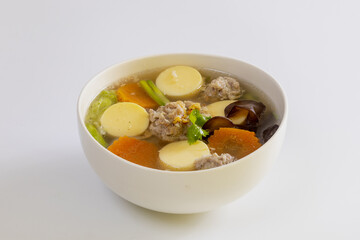 Tofu soup with minced pork in a white plate