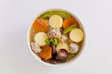 Tofu soup with minced pork in a white plate