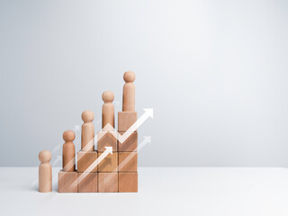 Leadership with business success concept. Modern rising up arrows and wooden figures standing on a...