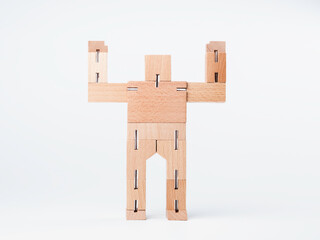 Wooden toy, geometric block robot hands up with strong power gesture standing isolated on white background, minimal style.