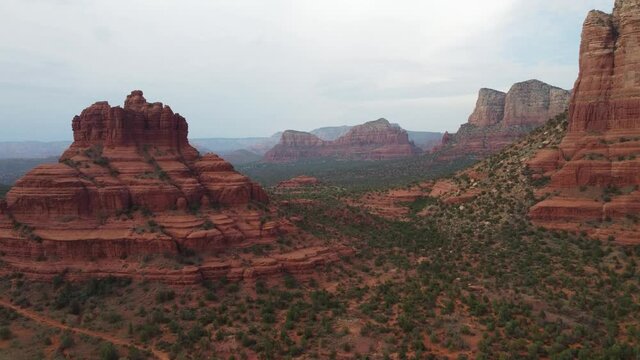The red rock defines nature in Sedona, Arizona. Canyon flight towards an iconic bridge in the heart of the midwest. Panoramic view of the iconic landscape