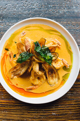 Thai Spicy Curried Prawns with coconut milk curry, lime leaf, banana chips
