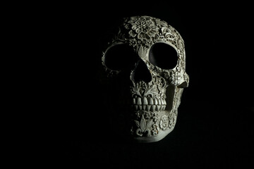 Day of the dead scull hand made with intricate carving and designs human skull sculpture