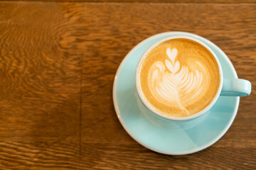 hot latte coffee cup on table