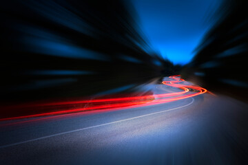 Cars light trails at night in a curve road - 462122065
