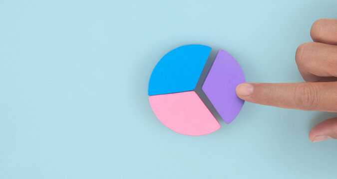 Business connecting piece of multi colored pie wood chart