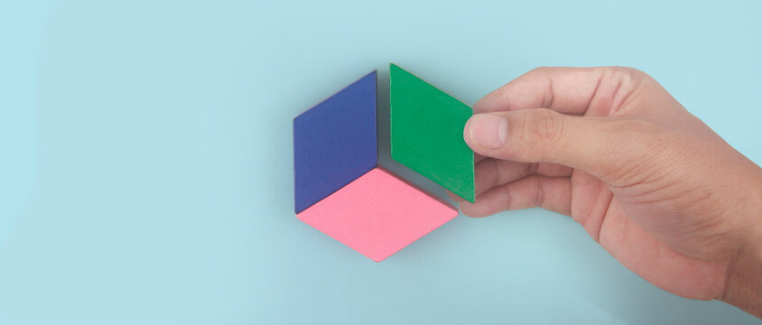 Business connecting piece of multi colored pie wood chart