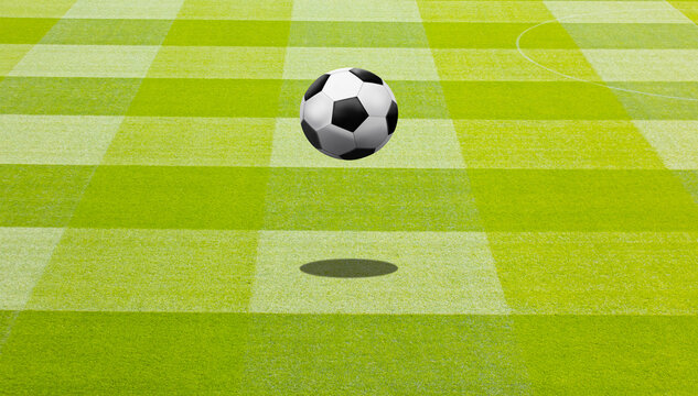 Close-up one black and white football ball over green turf of soccer field 