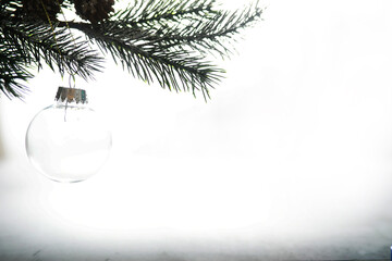 Evergreen tree handmade toys, snowflakes, globes and fir branch on stone background, Xmas greeting card with space for text wish