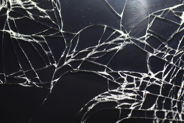 Crack on the glass. Broken screen. Broken phone. Cracked glass background. White cracks in the...