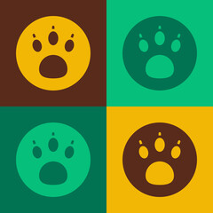 Fototapeta premium Pop art Paw search icon isolated on color background. Magnifying glass with animal footprints. Vector