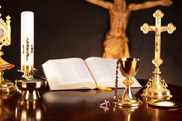 Catholic symbols composition. Religion concept. Jesus figure,The Cross, monstrance,  Holy Bible and...
