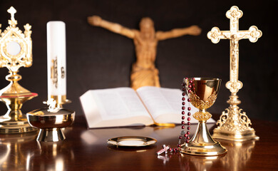 Catholic symbols composition. Religion concept. Jesus figure,The Cross, monstrance,  Holy Bible and...