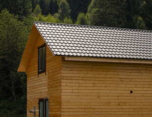 roof covered with metal tiles, roofing, wooden house