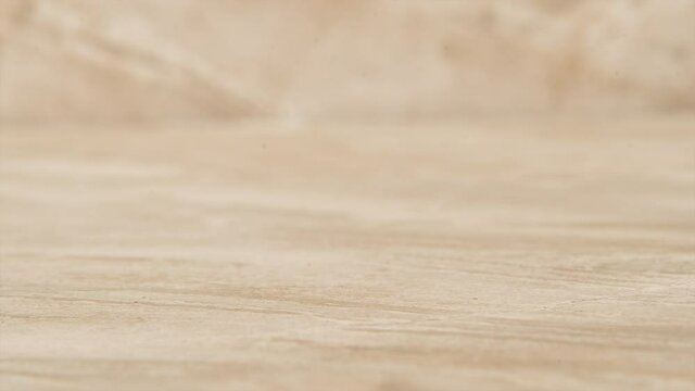 Stack of quarters vanishing from a table, stop motion animation
