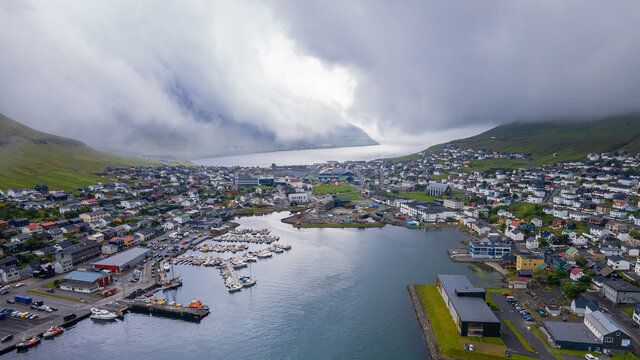 Beautiful aerial view of the City of Klaksvik in the Fareo Islands with its colorful houses and amazing canal and view to the majestic Kunoy Park