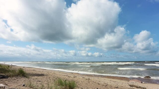 Baltic seascape view on sunny summer day. White clouds moving fast in blue sky.Time lapse video. 