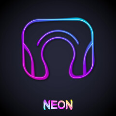 Glowing neon line Travel neck pillow icon isolated on black background. Pillow U-shaped. Vector