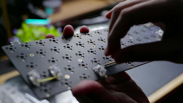 Footage of a person testing the stabilizer for custom build mechanical DIY keyboard.