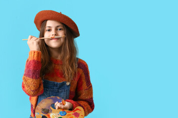 Funny little painter on color background