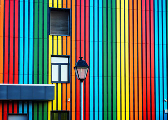 The multicolored wall of the building. Urban architecture.