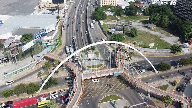 Top view of drone with zoom movement towards the main street maximo gomez in the city of santo domingo. tropical weather.