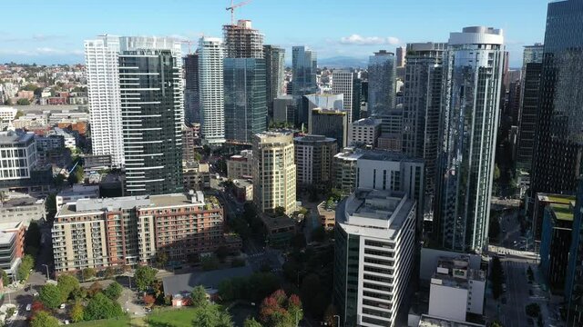 Cinematic 4K aerial drone footage of downtown Seattle, Uptown, Belltown, Denny Triangle, Cascade, Eastlake, Capitol Hill with high-rise office and residential buildings in Seattle