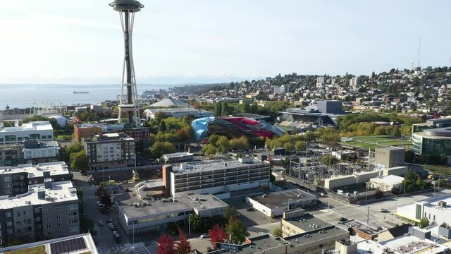 Cinematic 4K aerial drone dolly footage of downtown Seattle, Uptown, Belltown, Denny Triangle, Seattle Center, Space Needle, Elliott Bay, Queen Anne with new Climate Pledge Arena in Seattle