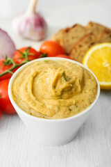Bowl with tasty baba ghanoush on table, closeup