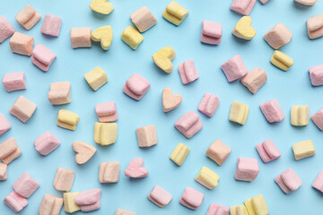 Tasty colorful marshmallows on color background