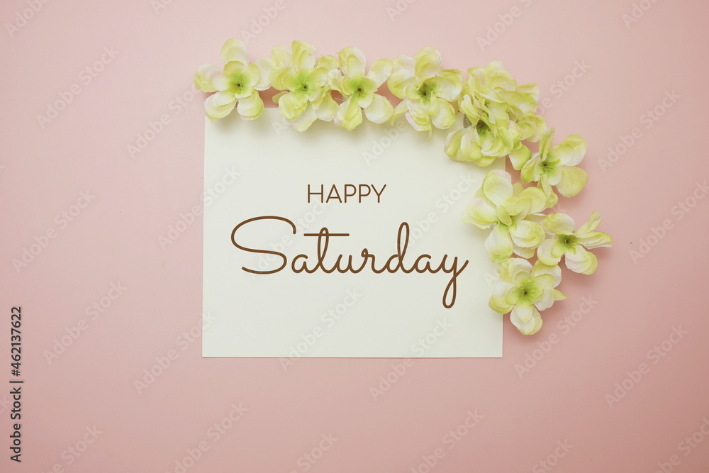 Poster Happy Saturday card typography text with flower bouquet on pink background